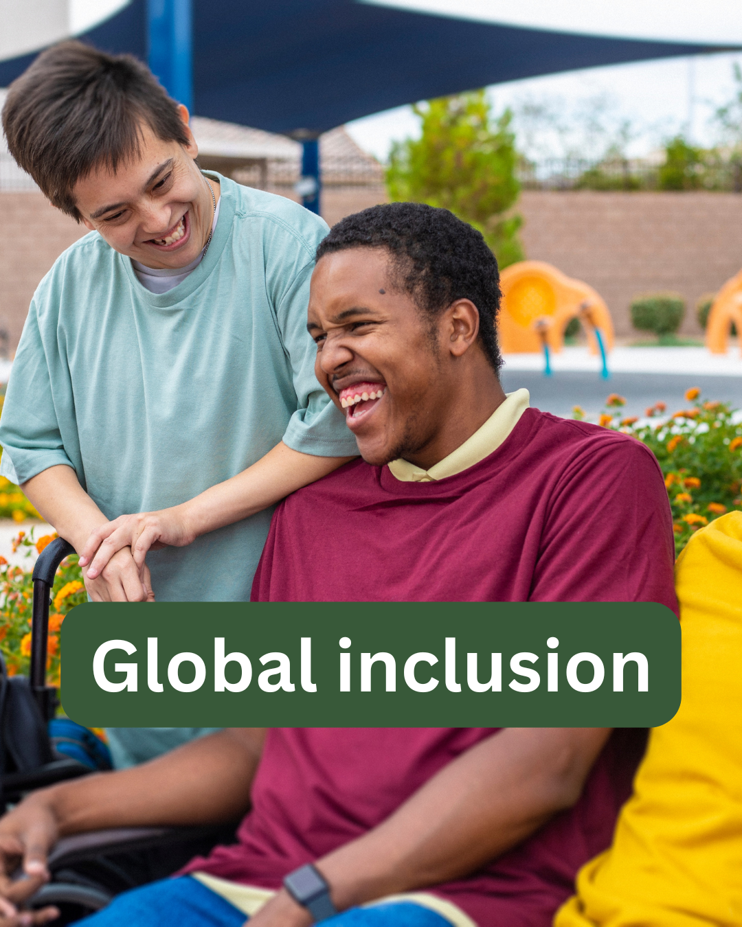 Two disabled people laughing together outdoors; text overlay reads "Global inclusion"